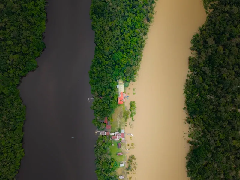 Drone view of the Eco Lodge, Lake Zacambú, and the Amazon River | Amazon Jungle Trips
