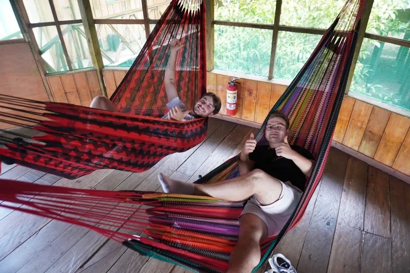 Hammocks beside Lake Zacambú with travelers | Amazon Jungle Trips
